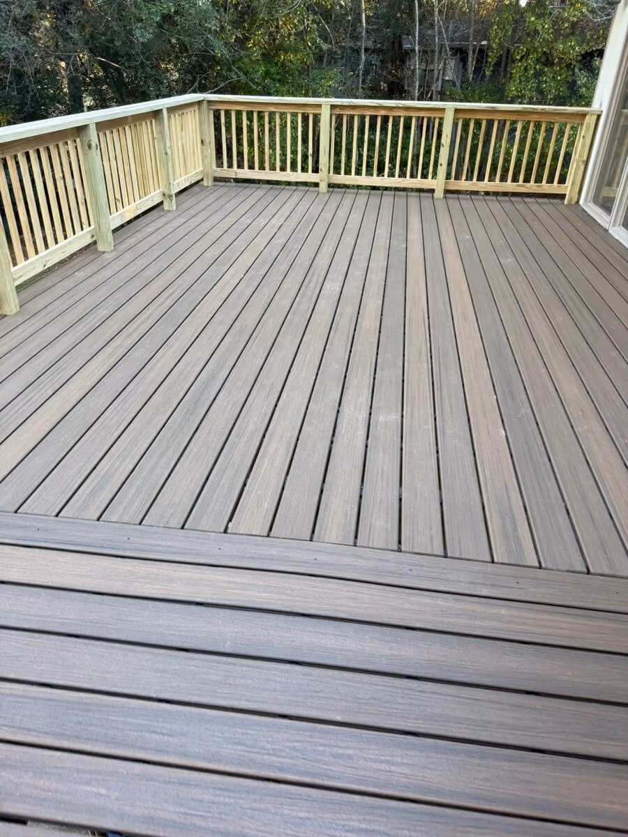 Completed composite-floor deck rebuild with new pressure-treated rails