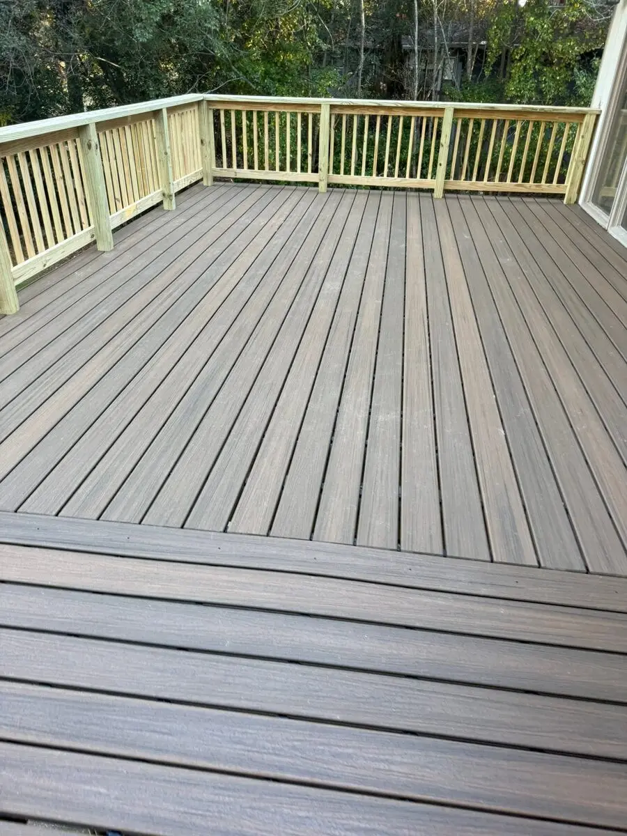 A rebuilt composite deck with new rail sections and a stair run