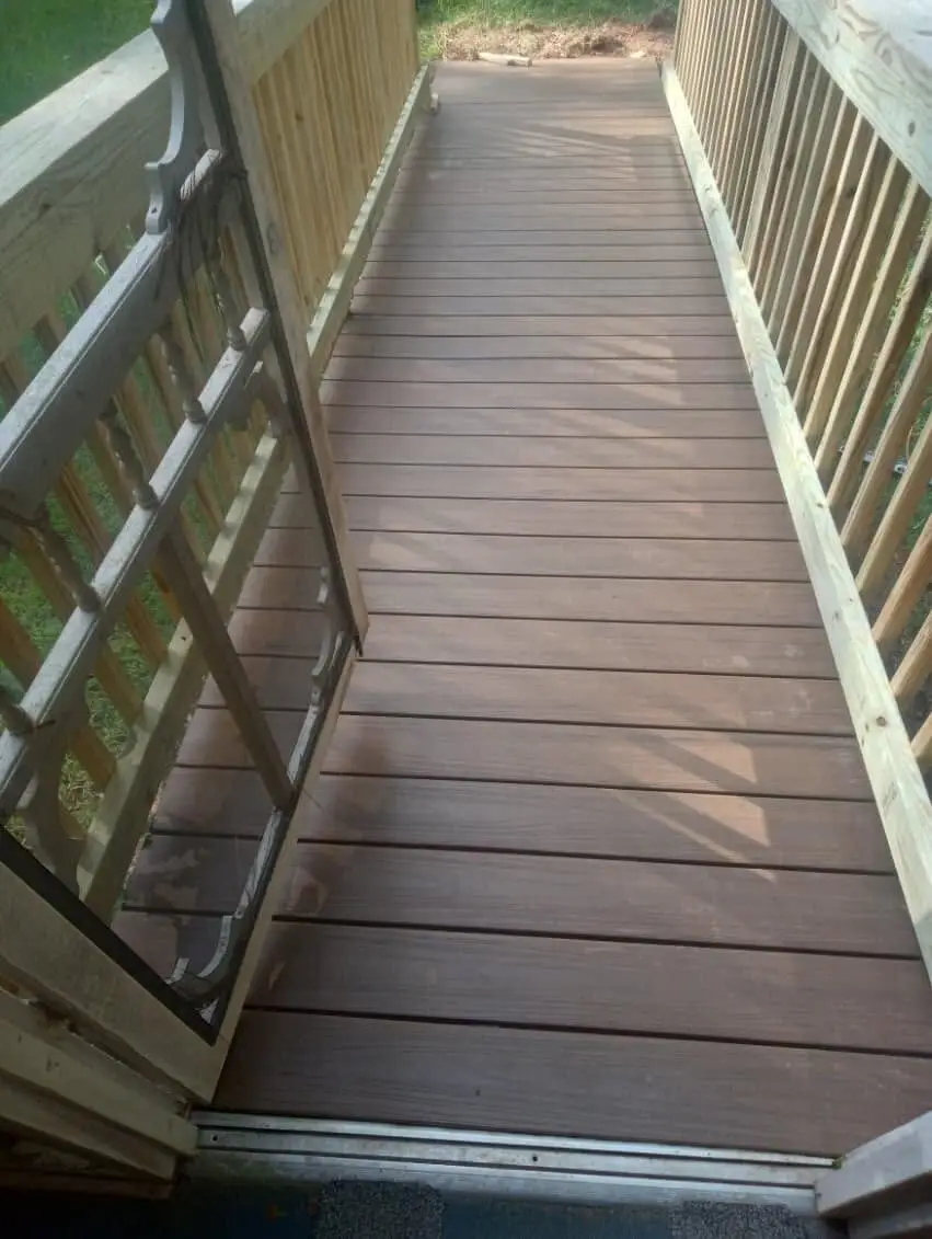 Completed composite walkway deck with new pine spindle railing