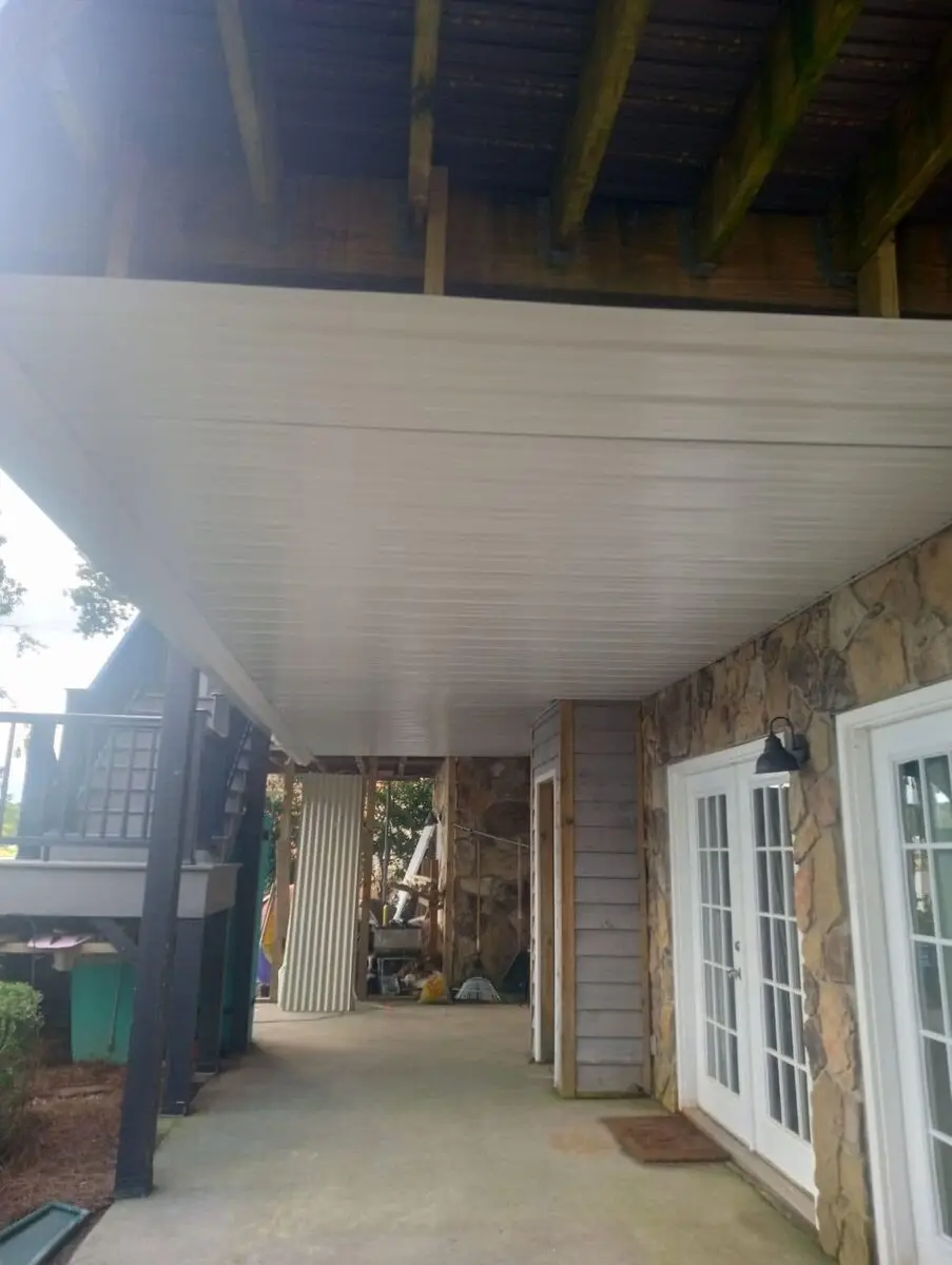 White beadboard ceiling installed under a covered porch
