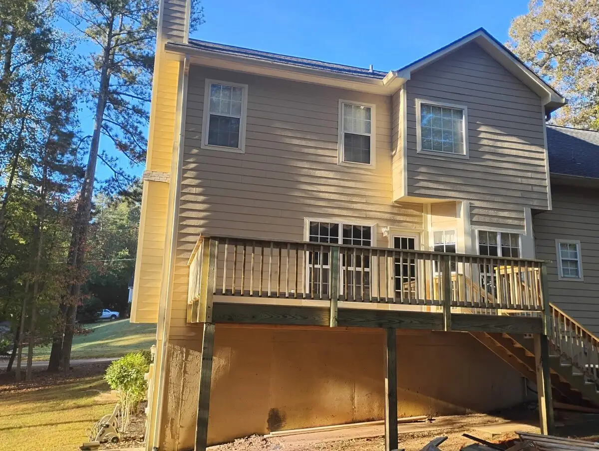 Split-level home with a brand-new pressure-treated deck and stairs