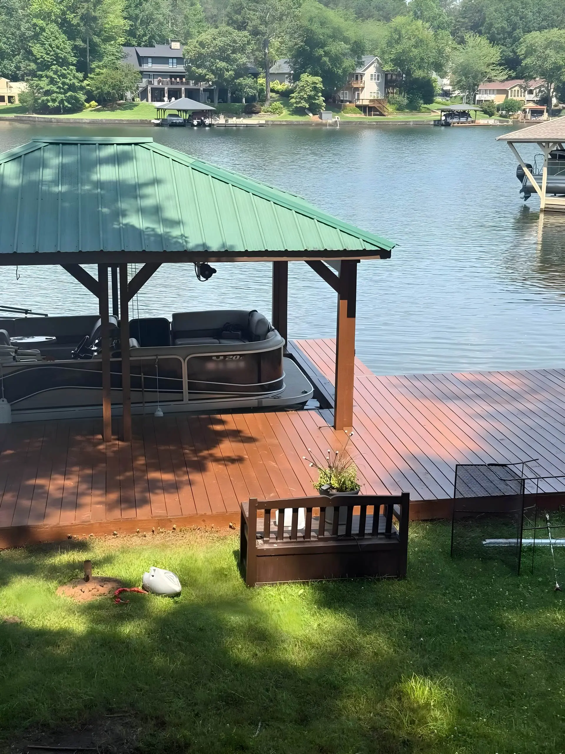 Freshly stained boat dock and covered slip on a West Georgia lake